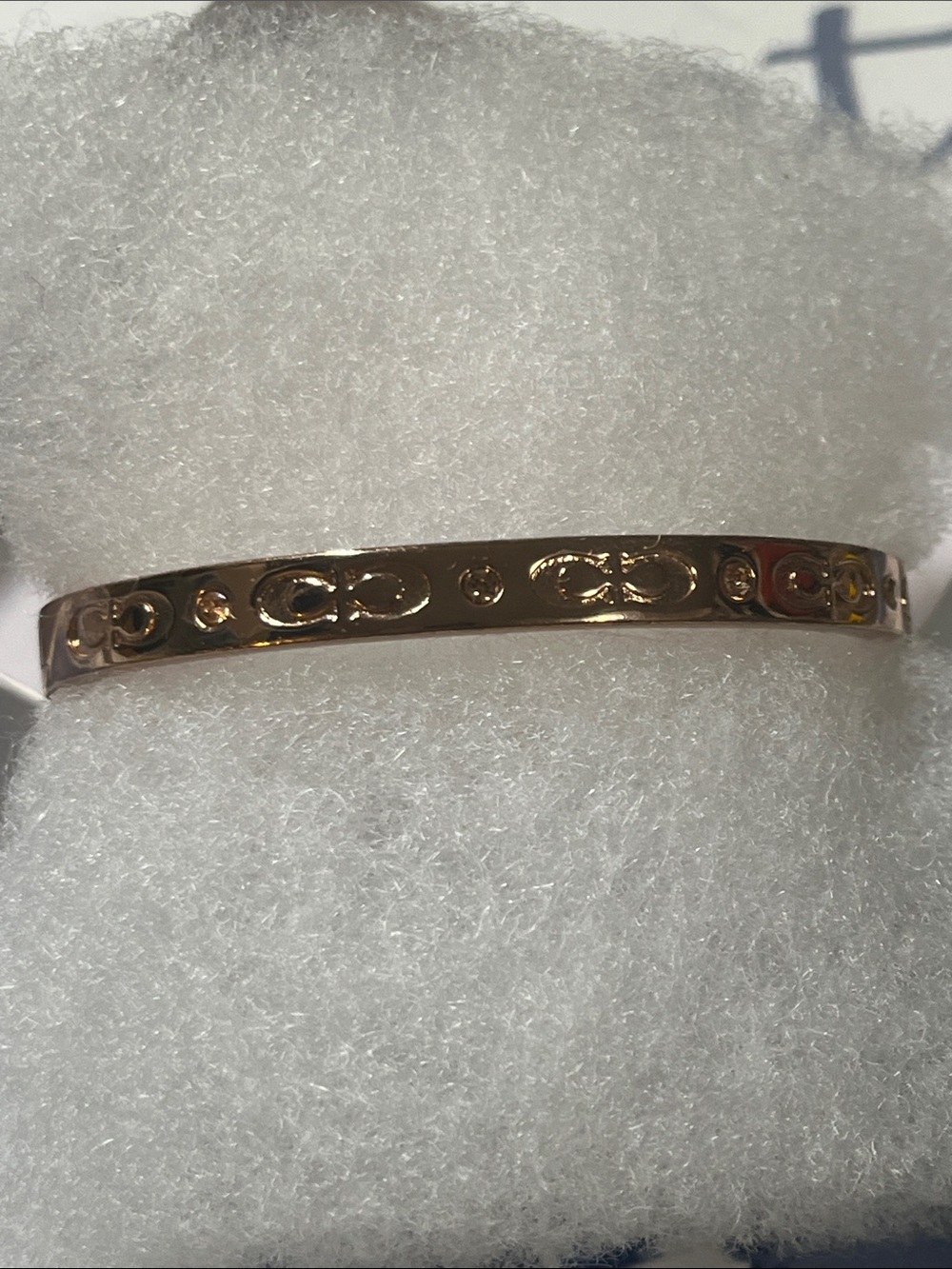 Coach Rose Gold Women's Bangle Bracelet with Engraved Motif